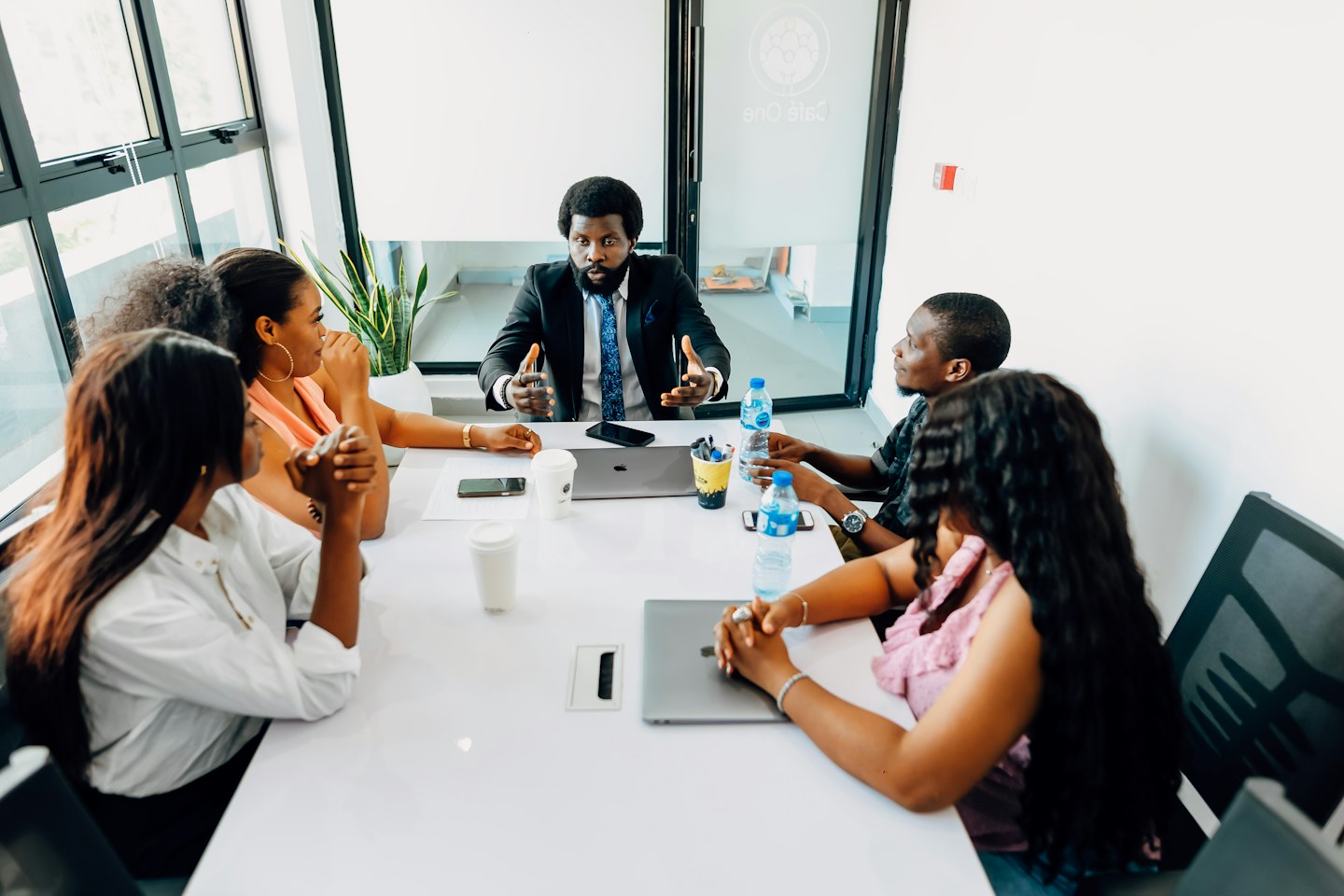 A group discussing work at a table in Lagos