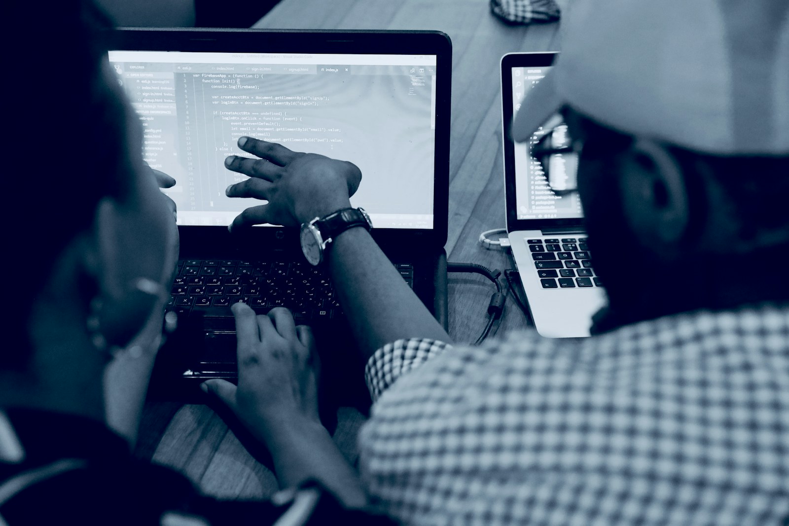 People learning together at a laptop in Yaba, Lagos