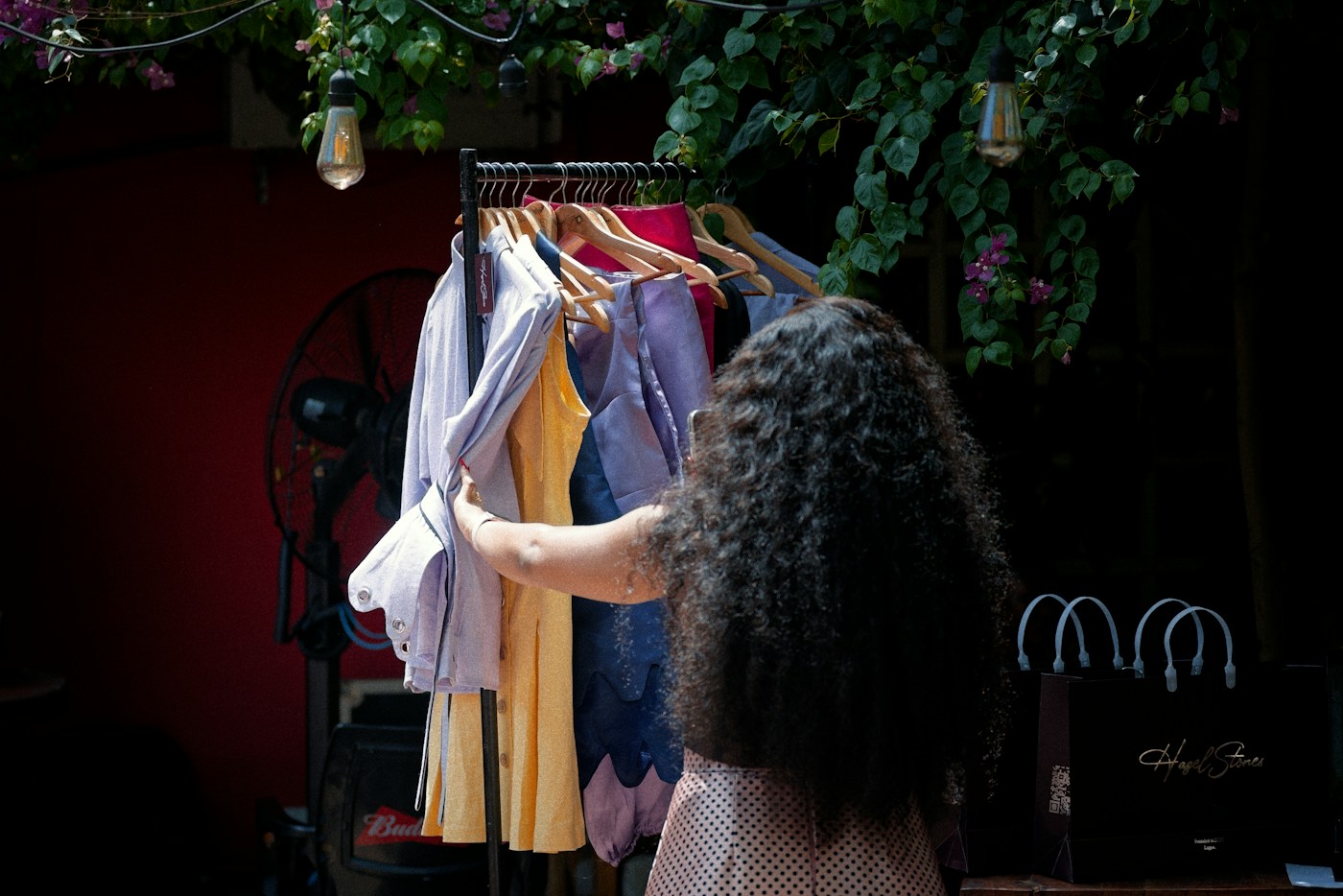 A woman selecting clothes at a shop in Lagos